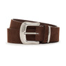 The Sanctuary Clothing Rowan Belt Chicory, featuring brown suede and a large, shiny silver buckle, is coiled neatly on a white background.