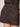 Close-up of a person wearing Sanctuary Clothing's all time linen short rhythmic, featuring black fabric with beige and brown geometric patterns. One hand is in the pocket, set against a plain light background.
