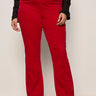 Red pants worn by a person on a plain background