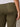 A person shown from the waist down, slightly from behind, wearing Sanctuary Clothing's retreat crop pant in burnt olive (extended sizing) and a white shirt, with one hand resting beside their hip.