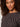 A woman with curly hair and a neutral expression wears the Sanctuary Clothing "the perfect tee rhythmic," shown from the shoulders up against a light background.