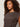 A woman with curly brown hair wears the Sanctuary Clothing charisma dolman mesh tee rhythmic, looking slightly to the side against a plain light background.