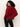 A woman with curly dark hair wears Sanctuary Clothing„¢s change of pace top in crimson, a long-sleeve high-collar sweater, paired with black leather pants. She stands against a plain light background, looking over her shoulder.