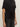 A person wears the Sanctuary Clothing satin mix tee in black, a short-sleeved top with waist gathering, paired with high-waisted black jeans. Only the torso and part of the arms are visible.