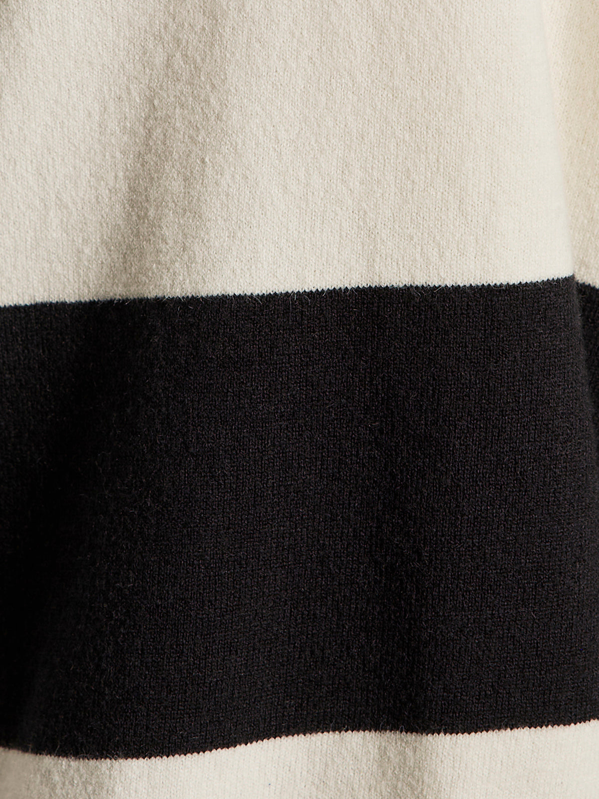 Close-up of the 24 7 popover black with chalk stripe by Sanctuary Clothing, highlighting its soft fabric and minimalist wide horizontal black and off-white stripes.