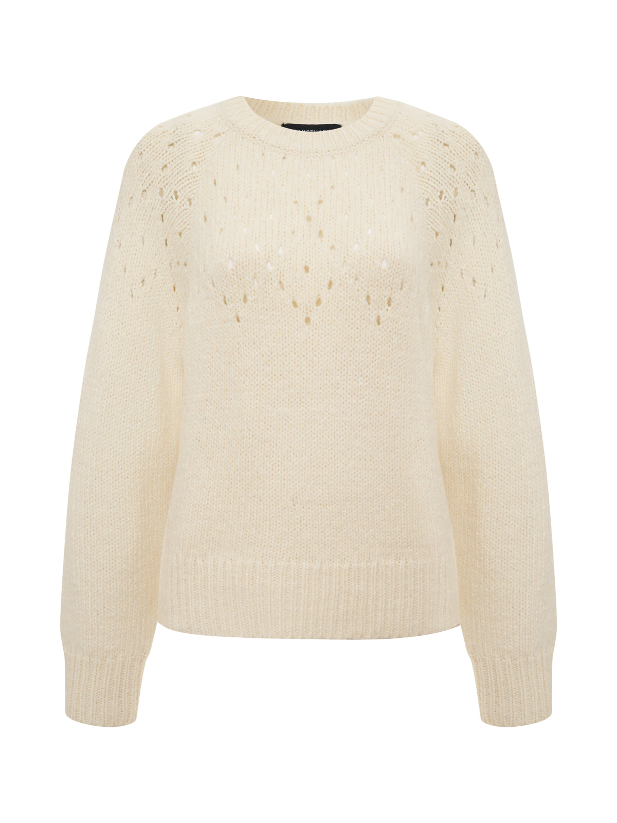 The femme openwork sweater in vanilla creme by Sanctuary Clothing features long sleeves, a round neckline, ribbed cuffs and hem, and a subtle diamond-shaped openwork pattern on the chest and shoulders.