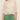 A woman models the Sanctuary Clothing metallic sweater tee in collagen petite sizing—its loose knit and three-quarter sleeves paired with green high-waisted pants, standing against a neutral background, her face partly out of frame.