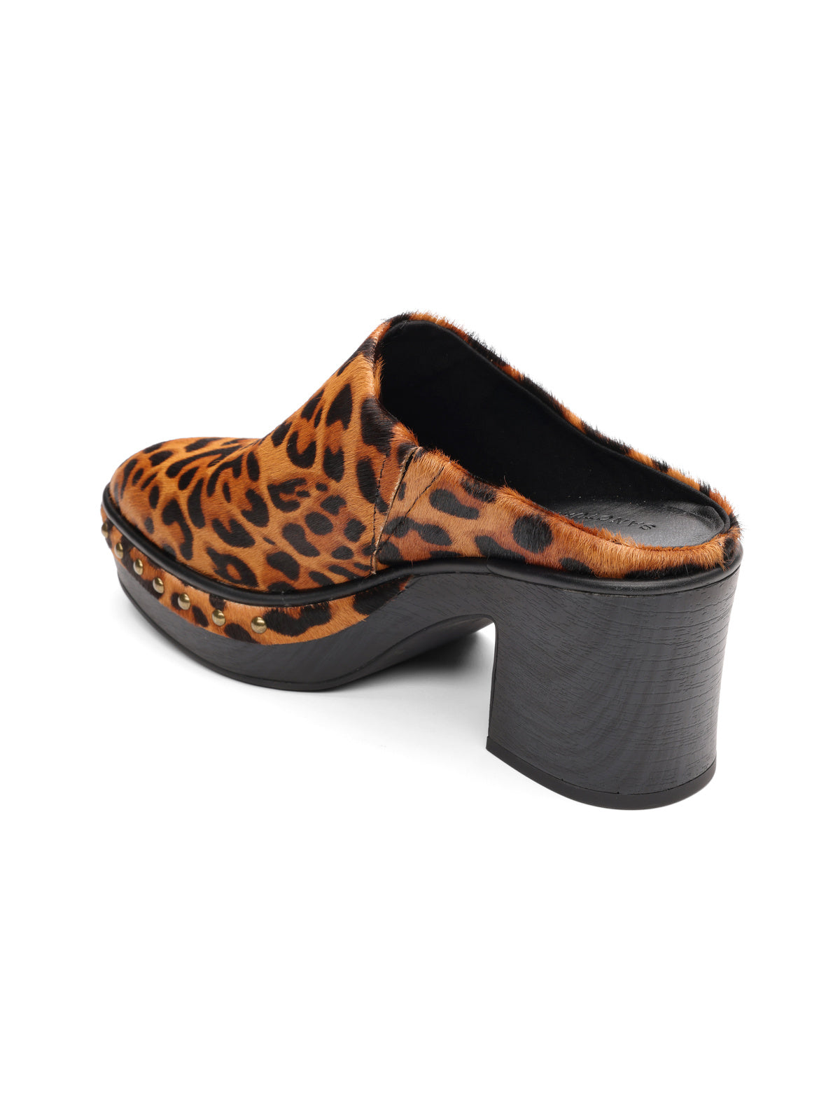 The emersyn mule bistro by Sanctuary Clothing features a chunky black wooden heel, bold leopard print upper, and metal stud accents along the sole edge.