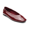 The gigi ballet flat in black wine by Sanctuary Clothing is a shiny burgundy patent leather shoe with a rounded toe and slight heel, shown on a white background.