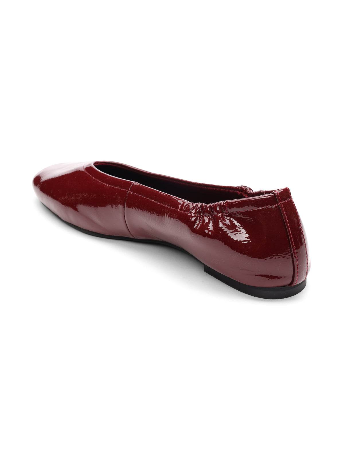 The Sanctuary Clothing gigi ballet flat in black wine features shiny maroon patent leather, a slightly pointed toe, and a black sole, displayed at an angled back view against a white background.