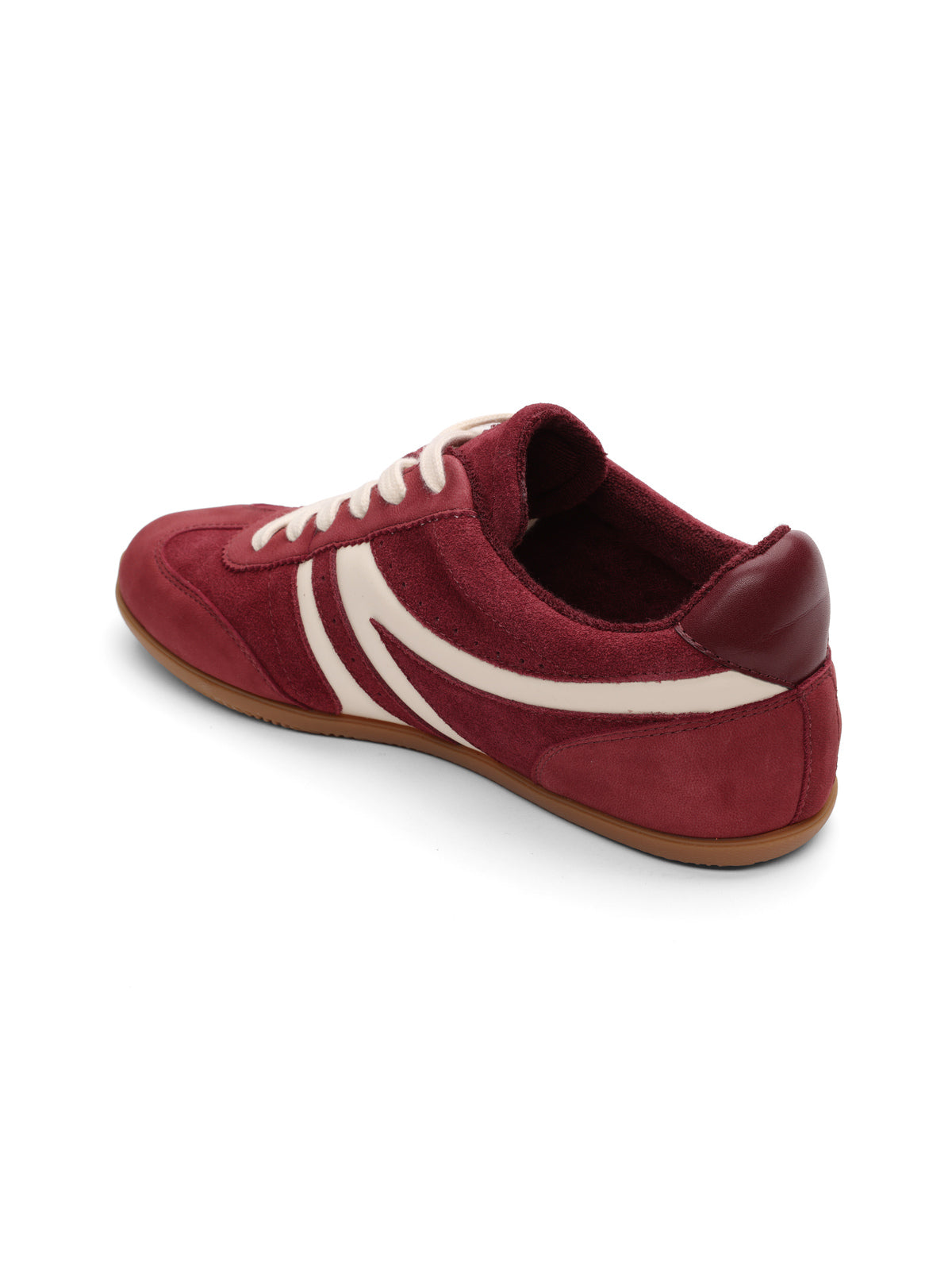 The Sanctuary Clothing lola sneaker crimson natural features a maroon color with white laces and stripes, a brown rubber sole, and suede-like texture, displayed at an angle on a white background.
