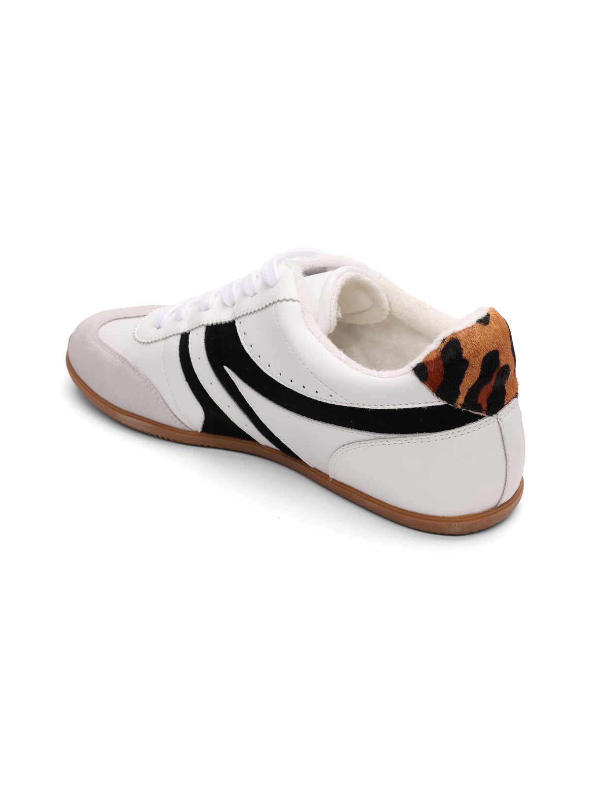 The lola sneaker by Sanctuary Clothing features a white and grey design with black stripes, a gray toe, brown gum sole, and a leopard print heel detail.