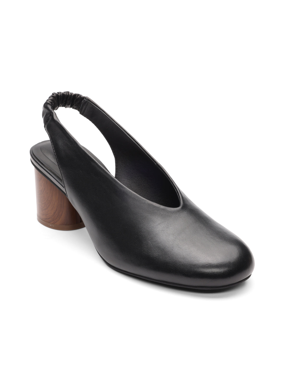 The Sanctuary Clothing Opera Sling Back Pump Black features a round toe, elasticized back strap, and a low, chunky wood-textured heel, shown against a white background.
