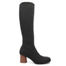 The Sanctuary Clothing ronnie tall shaft stretch boot in black features a rounded toe and chunky mid-height wooden heel, shown against a white background.