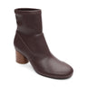 The rory stretch bootie chicory by Sanctuary Clothing is a brown ankle boot with a smooth leather finish and a medium-height, rounded wooden block heel, displayed at a slight angle on a white background.