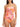 A woman wears the Sanctuary Clothing banded shirr side one piece multi, featuring thin straps, side ties, a square neckline, and a vibrant tropical floral print in pink, orange, yellow, and brown.