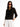 A woman in Sanctuary Clothing blue light glasses crimson, a black textured button-up sweater over a black top, and high-waisted white pants stands against a plain white background with one hand in her pocket.